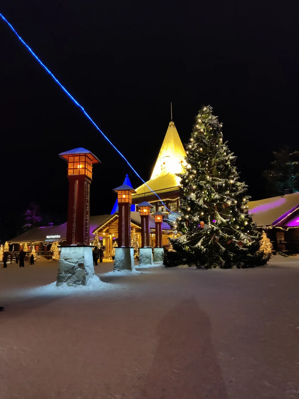 The illuminated Christmas tree and Santa Claus Office at Santa Claus Village at night